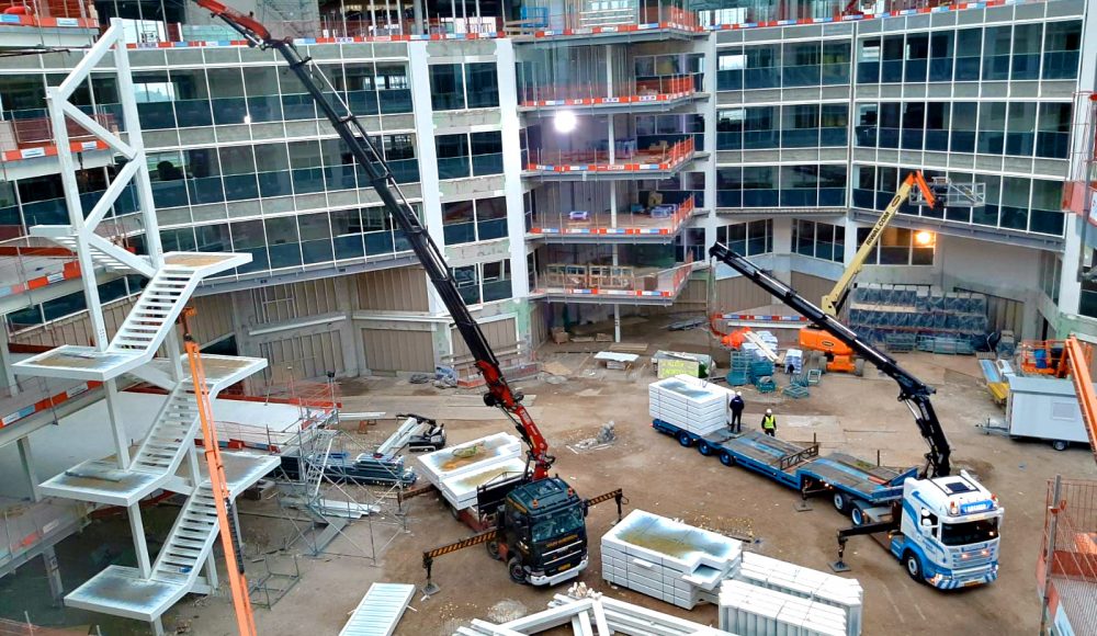 A-Fassi-F660RA-he-dynamic-and-a-F710RA-xhe-dynamic-crane-in-action-into-a-construction-site-at-Amsterdam-3